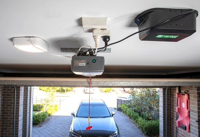 What are the advantages of a garage door opener with battery backup and a camera?